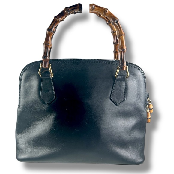 Gucci Elegant Black Leather Handbag with Bamboo Handles - Picture 1 of 12